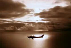 The Cessna 182 airplane flying over the ocean