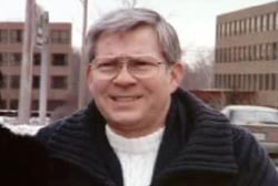 Smiling Phil Harris with glasses