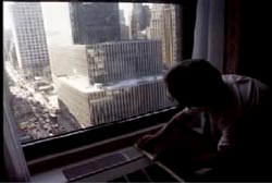 A hotel window overlooking the New York City Skyline