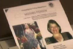 Someone holding a missing persons report for Judy smith that contains two photos of her