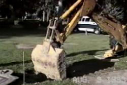 An excavator exhuming Leroy's body