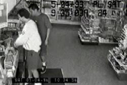 Security camera footage of Patrick with an unidentidied man at the register of a gas station