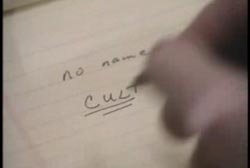 Man writting "no name cult"