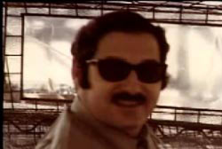 Smiling Ted Loseff with sunglasses and a mustache