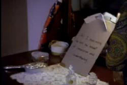 Ted Loseff's "suicide note" on a table with small relics