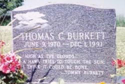 Grave stone that reads "Thomas C. Burkett June 9, 1970 - Dec 1, 1991"