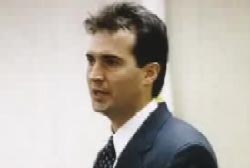 Adam Emery in a suit and tie at the trial
