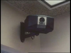 A security camera in the corner of a room
