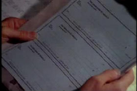 Man holding sheet of false checks
