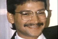 Mahfuz Huq smilling with glasses and a mustache