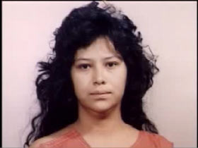 Mug shot of Maria Hernandez in an orange jumper