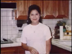 Maria Rosa Hernandez wearing a white shirt in a kitchen
