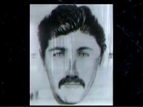 Police Sketch of a Caucasian man with dark hair dark eyes and a mustache