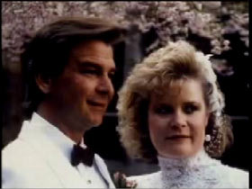 Philip Breen in a white tuxedo next to Kathleen Breen in a wedding dress
