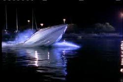 A speedboat speeding off into the night