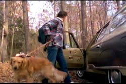 Bishop leaving his car in the middle of a Tennessee forest with his golden retreiver on a leash